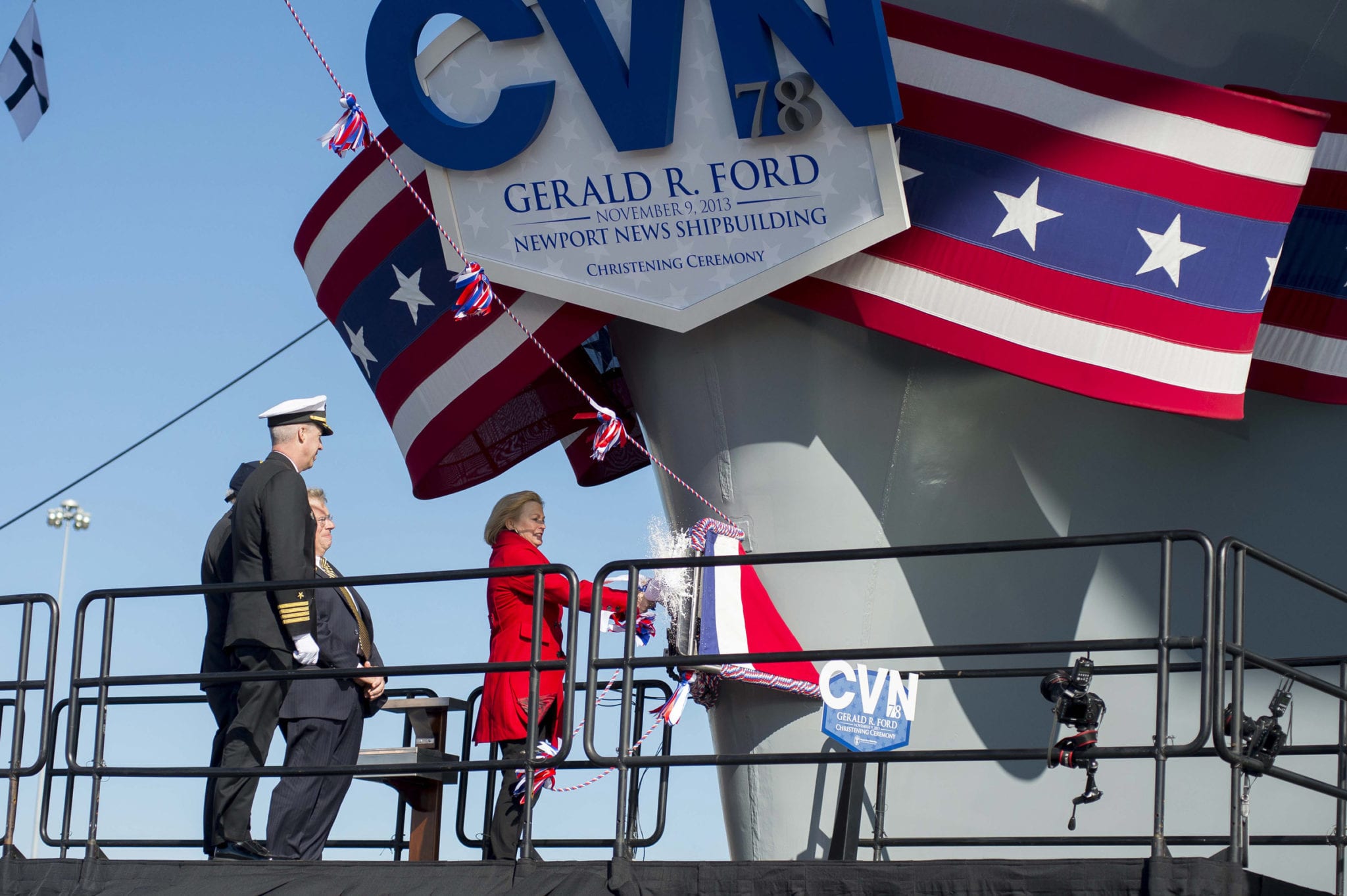 131109-N-WL435-911 NEWPORT NEWS, Va. (Nov. 9, 2013) Susan Ford Bales, daughter of former President Gerald R. Ford and sponsor of the aircraft carrier that bears his name, breaks a bottle of champagne on the bow of the aircraft carrier Gerald R. Ford (CVN 78) at Newport News Shipbuilding during the christening ceremony for the Ford. The first in class, Ford-class aircraft carrier, is scheduled to join the fleet in 2016. (U.S. Navy photo by Chief Mass Communication Specialist Peter D. Lawlor/Released)