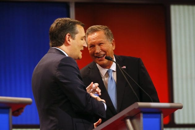 Republican presidential candidate, Ohio Gov. John Kasich , right, laughs with Sen. Ted Cruz, R-Texas, during a Republican presidential primary debate at Fox Theatre, Thursday, March 3, 2016, in Detroit. (AP Photo/Paul Sancya)