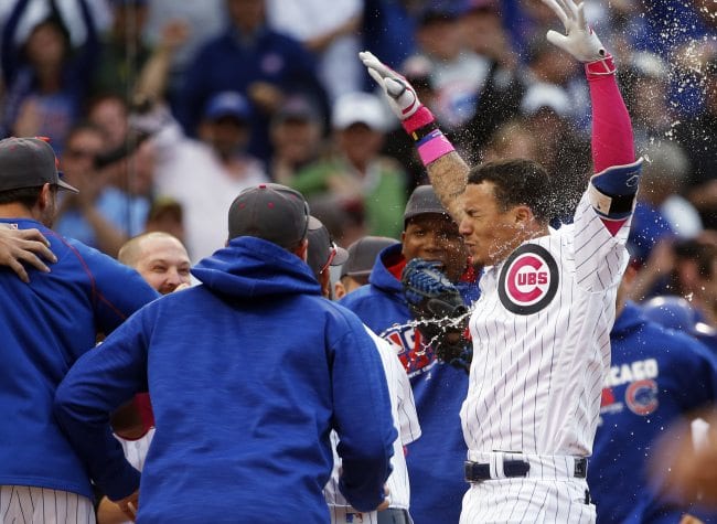 Chicago Cubs' Javier Baez, right, celebrates with teammates after hitting a baseball game-winning solo home run against the Washington Nationals during the 13th inning Sunday, May 8, 2016, in Chicago. (AP Photo/Nam Y. Huh)